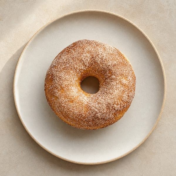 Pieczone pączki drożdżowe z cynamonowym pudrem