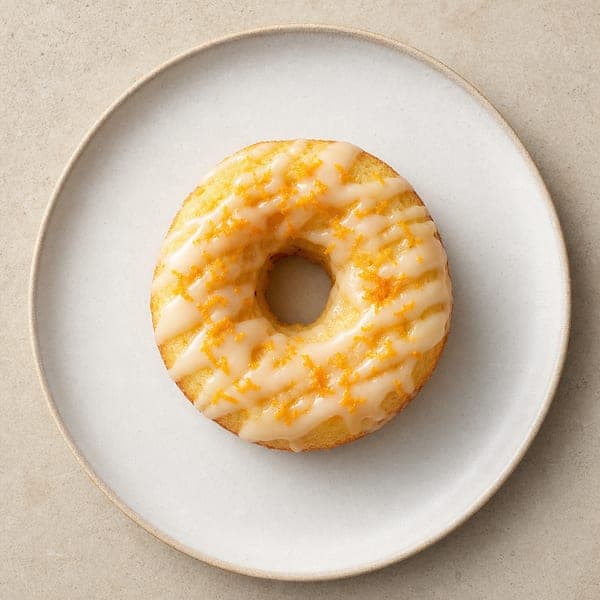 Pieczone pączki z cytrynowym lukrem i skórką pomarańczy